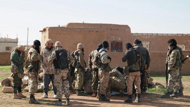 Photo posted by al-Baraka division of Islamic State purportedly showing militants taking a break during battle with Kurdish and Christian militia near Tal Hamr, Hassakeh province, Syria (25 February 2015)