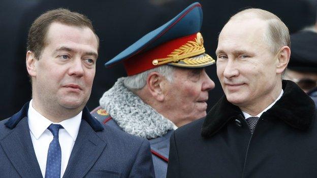 Russian President Vladimir Putin and Prime Minister Dmitry Medvedev at a a wreath-laying ceremony at the Tomb of the Unknown Soldier in Moscow on 23 February 2015.