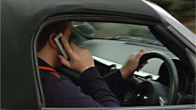 Driver using mobile phone (picture posed by model)