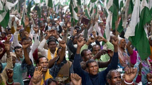 Indian farmers shout anti-government slogans during a protest against the government’s proposed move to ease rules for acquiring land to facilitate infrastructure projects in New Delhi, India, Wednesday, Feb. 25, 2015