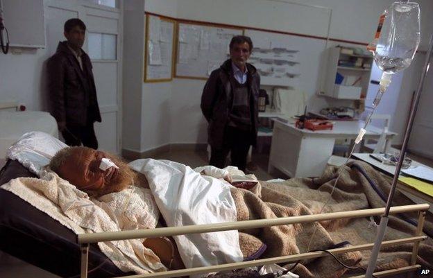 An avalanche survivor man lies on a bed at Emergency Hospital in Panjshir province north of Kabul, Feb 25