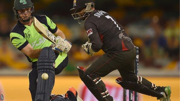 Gary Wilson gets the ball past UAE wicketkeeper Swapnil Patil