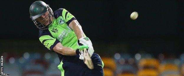 Kevin O'Brien launches into a big shot on his way to a blistering half century at the Gabba