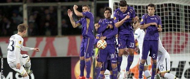 Fiorentina's wall blocks a Christian Eriksen free-kick