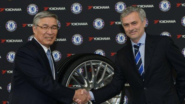 Yokohama Rubber Company chairman Tadanobu Nagumo with Chelsea manager Jose Mourinho