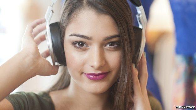 Teenager listening to music