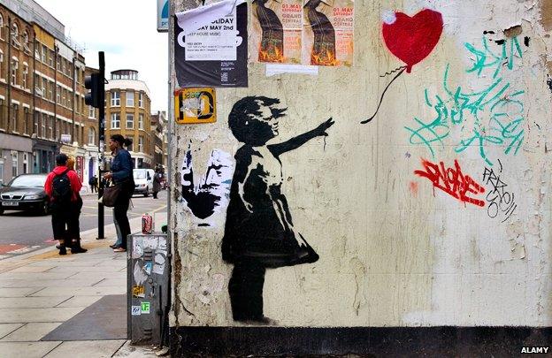 Banksy image of girl letting go of heart-shaped balloon