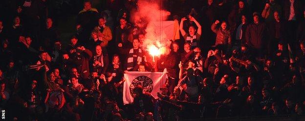 Celtic fans set off a firework in the San Siro