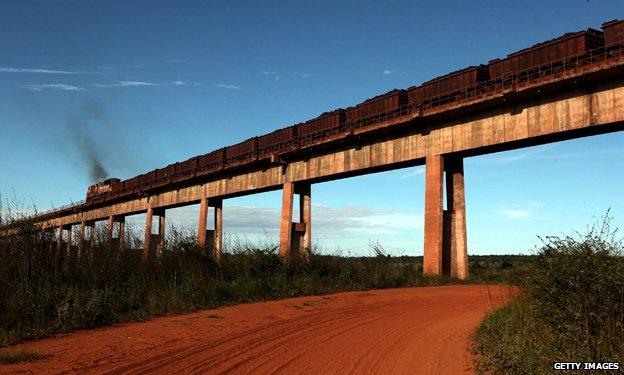 Iron ore being transported on a train