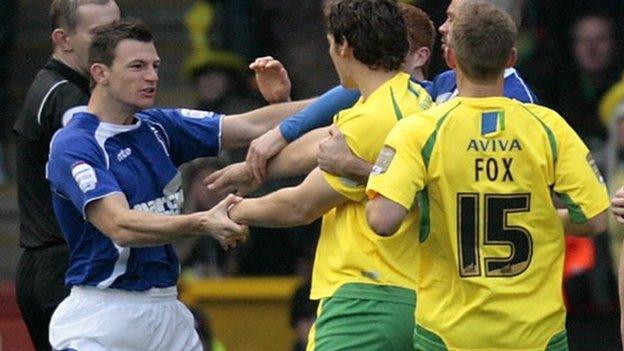 Ipswich and Norwich players tussle