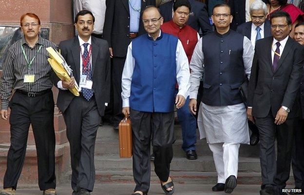 India"s Finance Minister Arun Jaitley (C) leaves his office to present the 2015/16 federal budget in New Delhi February 28, 2015.