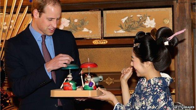 Prince William is given a gift by an actress