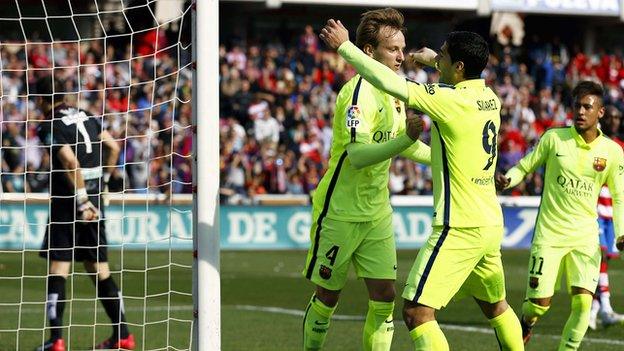 Luis Suarez congratulates Ivan Rakitic