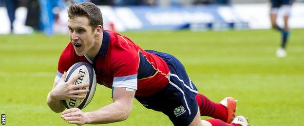 Mark Bennett crosses for his first Scotland try, against Italy