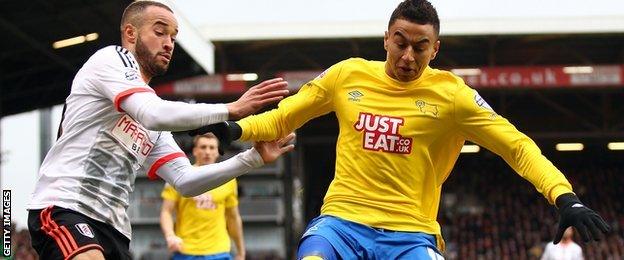 Fulham in action against Derby County at Craven Cottage
