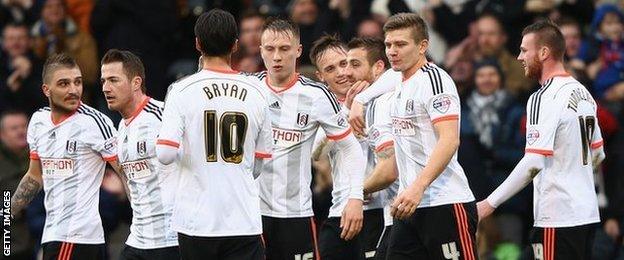 Fulham's players celebrate their opening goal against Derby