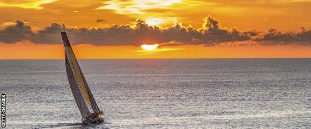 Overall race leaders Abu Dhabi Ocean Racing during sunrise as they approach Auckland, New Zealand