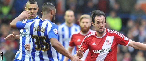 Kike and Sheffield Wednesday players battle for the ball