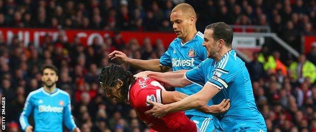 Sunderland defenders Wes Brown (centre) and John O'Shea (left) challenge Manchester United's Radamel Falcao