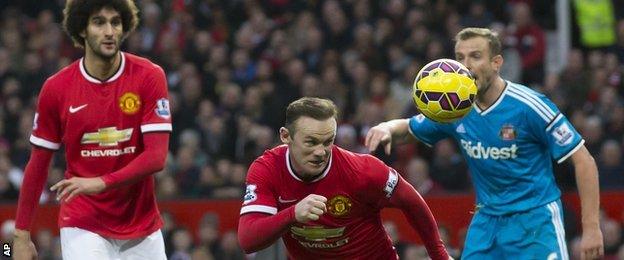 Manchester United striker Wayne Rooney heads in his side's second goal against Sunderland