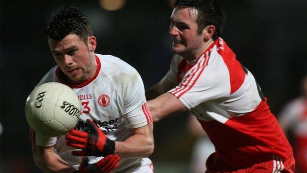 Tyrone's Darren McCurry battles with Derry's Oisin Duffy at Omagh