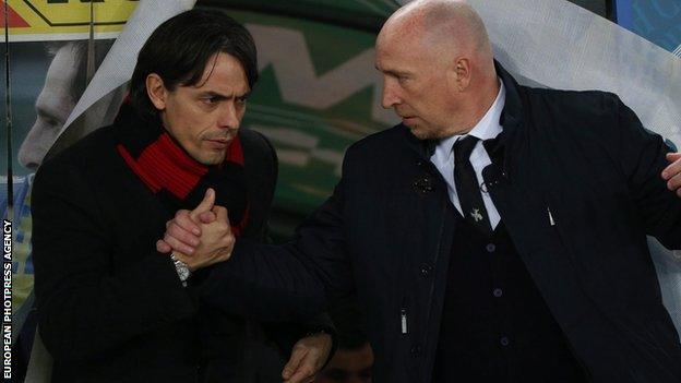 Milan's head coach Filippo Inzaghi (L) greets Chievo's head coach Rolando Maran