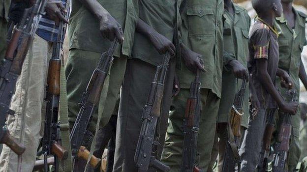 Child soldiers prepare to lay down their arms at a ceremony in South Sudan