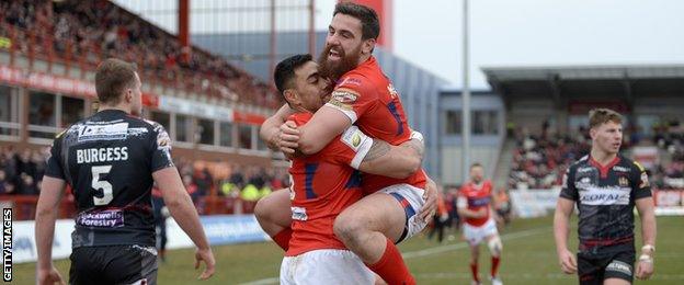 Ken Sio of celebrates his opening try with Tyrone McCarthy