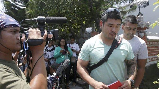 Australian Michael Chan (C), the brother of death-row prisoner Andrew Chan, talks to the media