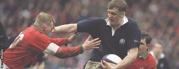 Doddie Weir fends off Wales' Neil Jenkins during the 1995 Five Nations Championship