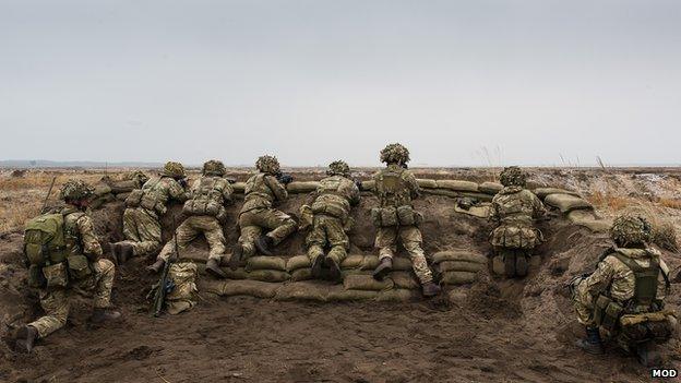 Soldiers from the 1st Battalion The Royal Welsh, scan the horizon for the enemy during Exercise Black Eagle in Poland.