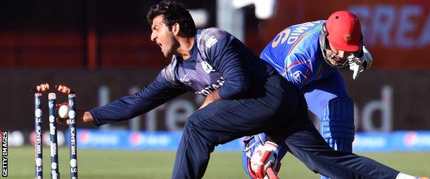 Scotland's Majid Haq tries to run out Afghanistan's Hamid Hassan