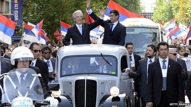 Tabare Vazquez and Raul Sendic wave to supporters in Montevideo on 1 March 2015