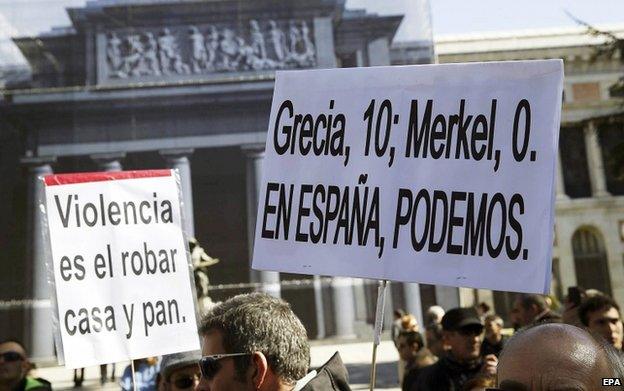 Protesters hold during a protest against Spain's austerity measures in Madrid on 22 February 2015