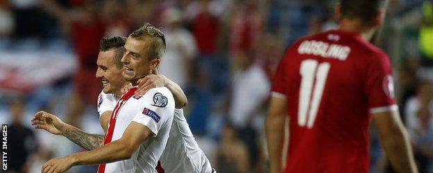 Kamil Grosicki and Arkadiusz Milik celebrate for Poland against Gibraltar