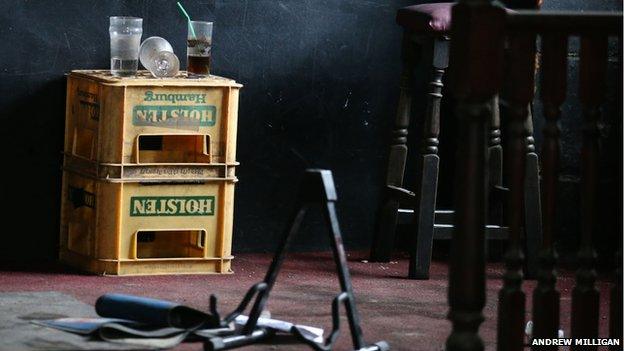 a music stand and the band's drinks