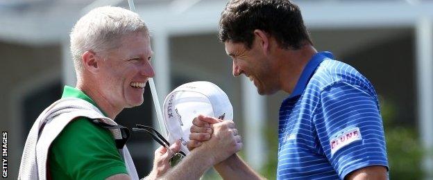 Padraig Harrington celebrates with his caddie