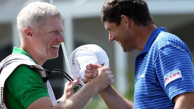 Padraig Harrington celebrates with his caddie