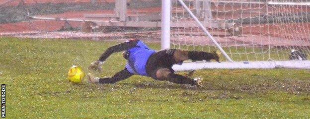 Chris Tardif saves a penalty against Hastings United