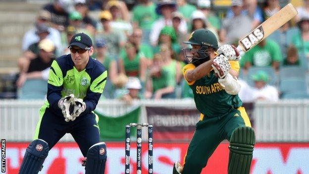 Hashim Amla after hitting a cut shot with Ireland wicket-keeper Gary Wilson looking on