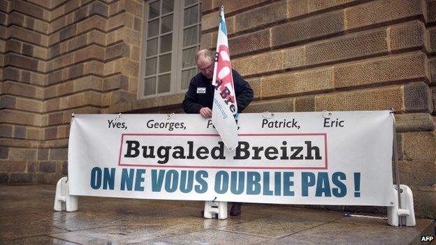 Campaign group placard reads "We won't forget you"