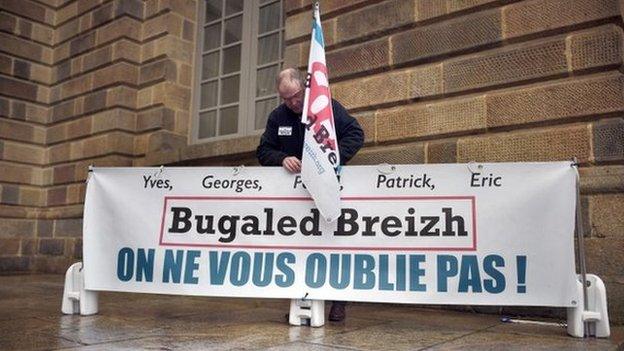 Campaign group placard reads "We won't forget you"