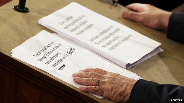 Israeli Prime Minister Benjamin Netanyahu holds a copy of his speech with handwritten edits as he addresses a joint meeting of Congress in the House Chamber in Washington on Tuesday