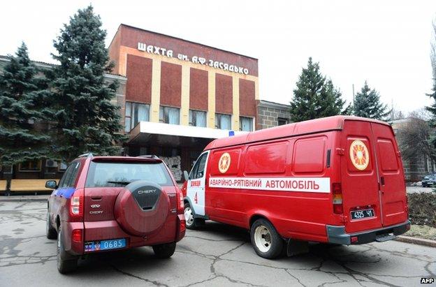 Emergency vehicles stand outside the Zasyadko mine, 4 March