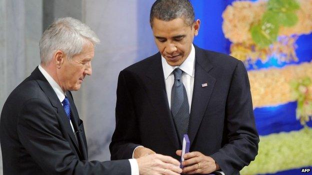 Norwegian Nobel Peace Prize Committee chairman Thorbjoern Jagland handing the diploma and medal to Nobel Peace Prize laureate, US President Barack Obama