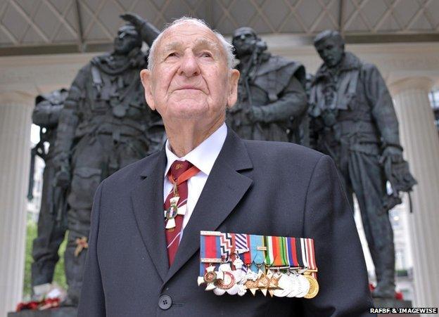 Les Munro wearing his decorations and medals, standing in front of the Bomber Command Memorial in Green Park, London, in 2013