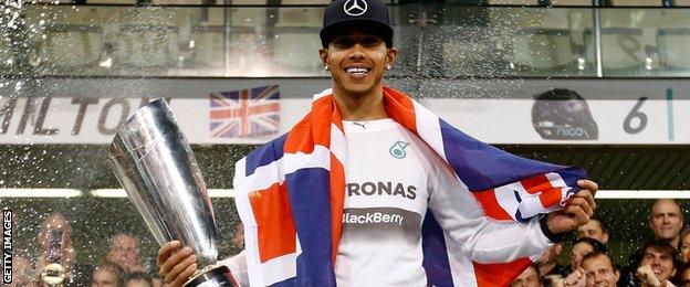 Lewis Hamilton celebrates his 2014 Formula 1 title in Abu Dhabi