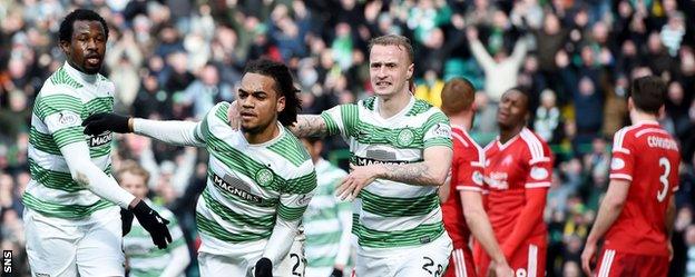 Celtic players celebrate Jason Denayer's goal against Aberdeen