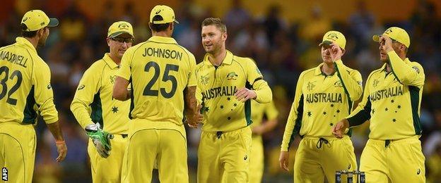 Michael Clarke (centre) celebrates after taking the wicket of Samiullah Shinwari