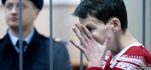 Ukrainian airforce officer Nadia Savchenko reacts inside a defendants' cage as she attends a hearing at the Basmanny district court in Moscow on 4 March 2015